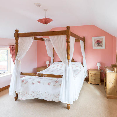 Thumb coachman s cottage four poster bed landscape